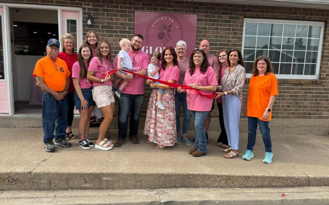 Community members and salon owners gather outside Glorify Salon in downtown Belle, Missouri, during the ribbon cutting ceremony on Friday, May 15, 2026.